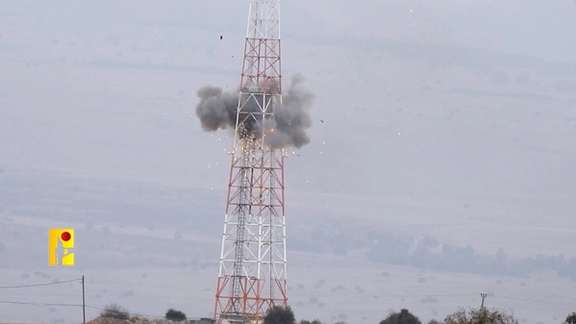 An explosion is seen on a tower that the Islamic Resistance said was at an Israeli military site near the Israel-Lebanon border in this screengrab obtained from a social media video by Reuters on October 19, 2023.