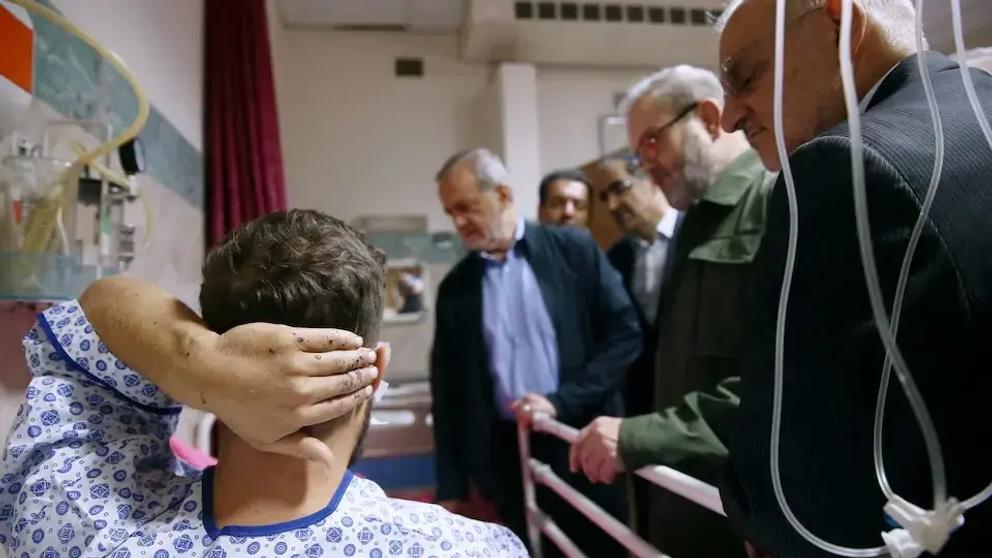 Iran's President Masoud Pezeshkian visits one of the victims injured by pager explosions across Lebanon, in a hospital in Tehran, Iran, September 20, 2024.