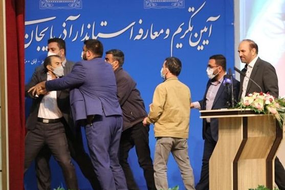 Man who slapped Governor Abedin Khorram being restrained. October 23, 2021