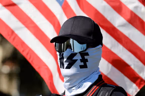 A member of the white nationalist group NatSoc Florida protests against U.S. support for Israel, in response to the war between Israel and Hamas, in Lady Lake, Florida, US, October 21, 2023.