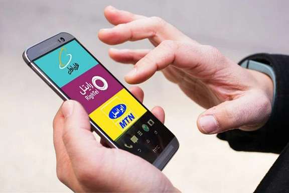 A mobile phone screen shows Iranian internet providers