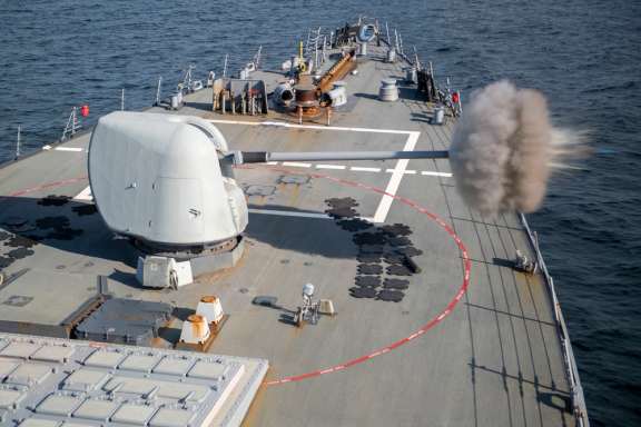 the Arleigh Burke-class guided-missile destroyer USS Laboon (DDG 58) fires a round from the Mark 45, Mod 2, 5 inch gun during a live-fire exercise in the Atlantic Ocean. (January 2021)