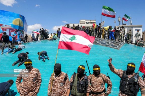 Islamic Republic’s supporters holding Lebanese flag in the capital Tehran during Quds day rallies on April 14, 2023