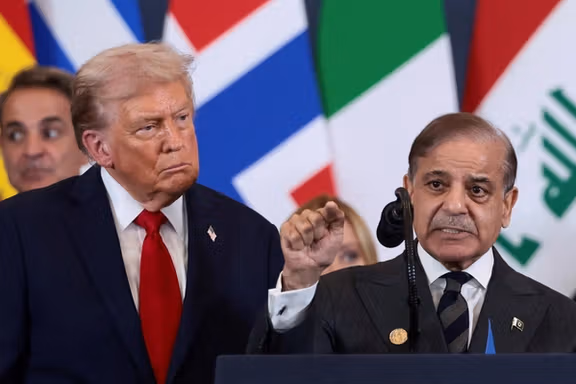 US President Donald Trump looks at Pakistan's Prime Minister Shehbaz Sharif speaking following the official signing of the first phase of the Gaza ceasefire agreement between Israel and Hamas, during a world leaders' summit on ending the Gaza war, in Sharm El-Sheikh, Egypt, October 13, 2025.