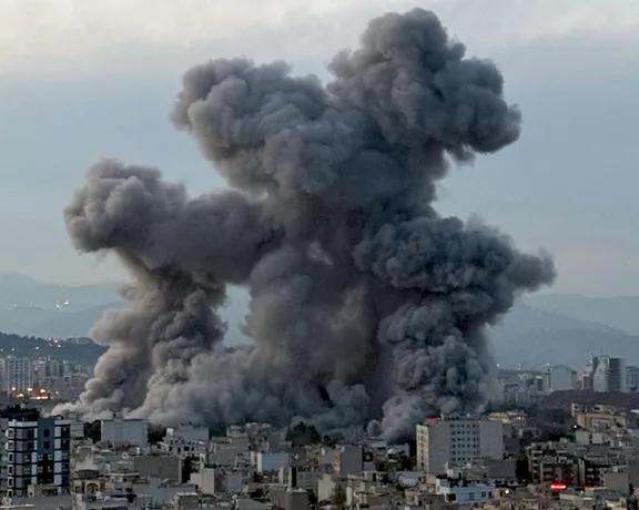 Smoke billows after strikes in Tehran on April 1, 2026