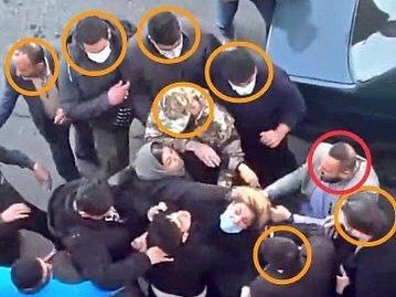 Plainclothes agents during the arrest of a mother whose daughter was poisoned in attacks on girls’ schools