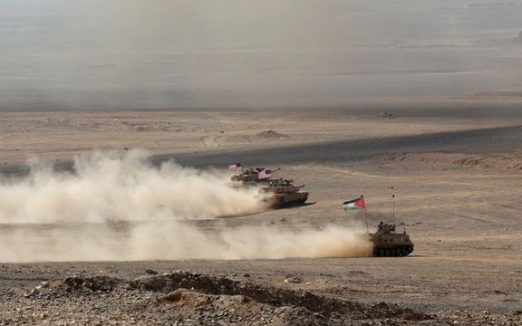 Military vehicles with Jordanian and US flags drive as part of the 'Eager Lion' military exercises, in Zarqa, Jordan September 14, 2022.