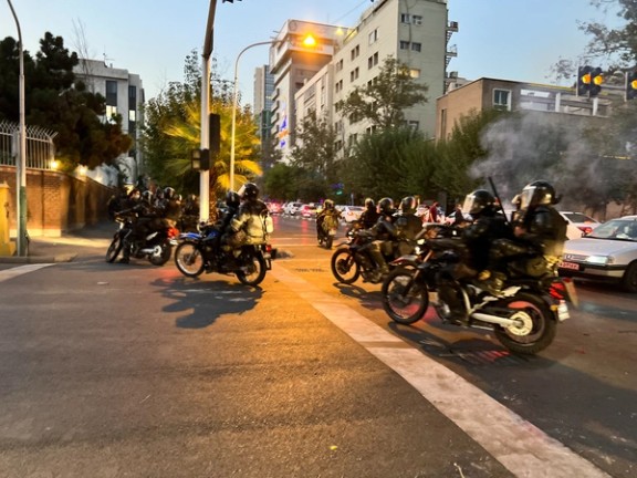Police arrive to disperse demonstrators during a protest over the death of Mahsa Amini, a woman who died after being arrested by the Islamic republic's "morality police", in Tehran, Iran September 19, 2022.