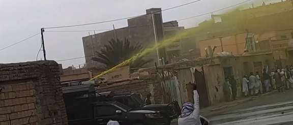 An image provided by an eyewitness on Friday 20 October 2023 shows a water cannon spraying yellow liquid to disperse protests and facilitate subsequent arrest of marked protesters. (Amnesty International)
