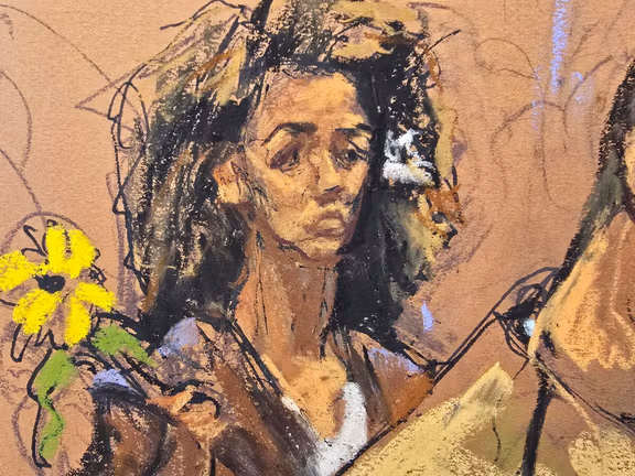 Prominent New York-based dissident and journalist Masih Alinejad holds a sunflower during the sentencing of Polad Omarov and Radar Amirov, who were convicted of involvement in an unsuccessful Iran-backed plot to kill her, at federal court in New York, October 29, 2025 in this courtroom sketch.