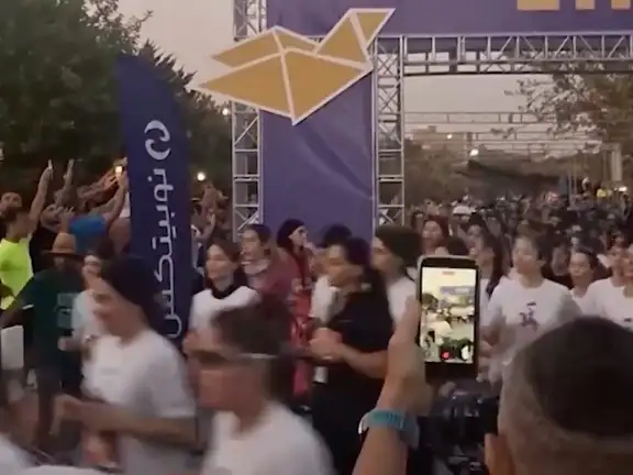 A screen-grab from a viral video shows many women running a 10k race in Tehran without covering their hairs, September 18, 2026