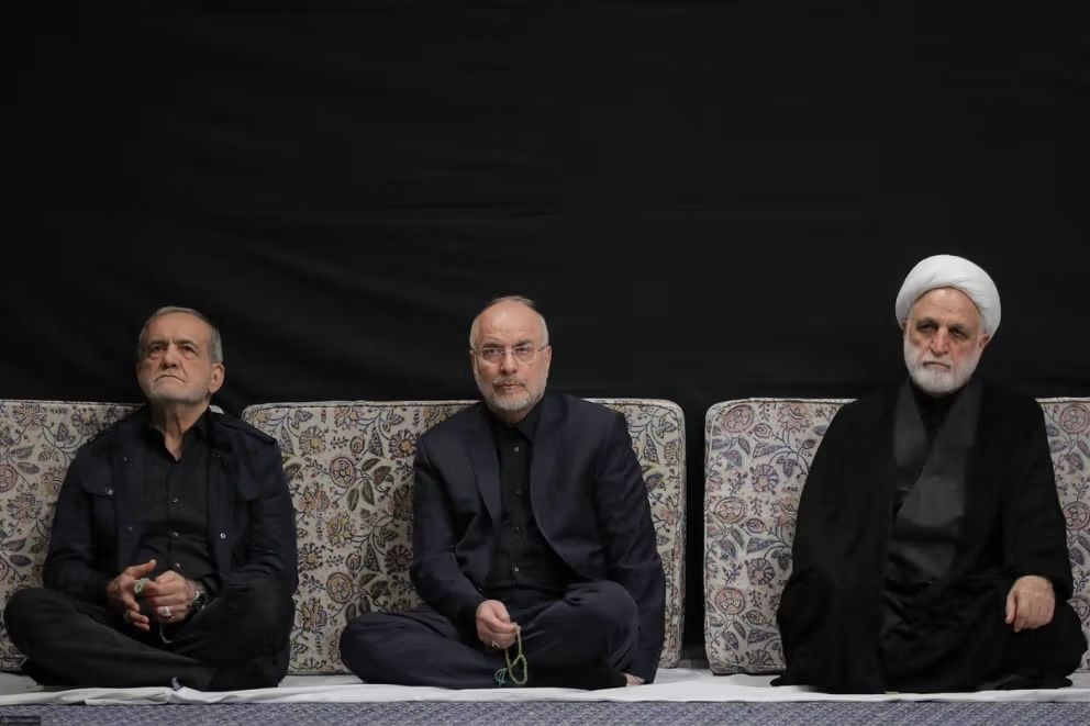 Judiciary Chief Gholamhossein Mohseni Ejei, recently appointed to a new five-year term, attends a ceremony alongside President Masoud Pezeshkian (left) and Parliament Speaker Mohammad Bagher Ghalibaf (center).