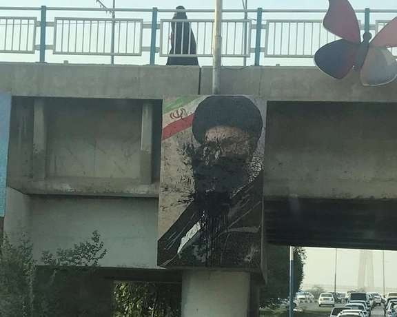 A Khamenei poster defaced with black paint in Iran in October 2022