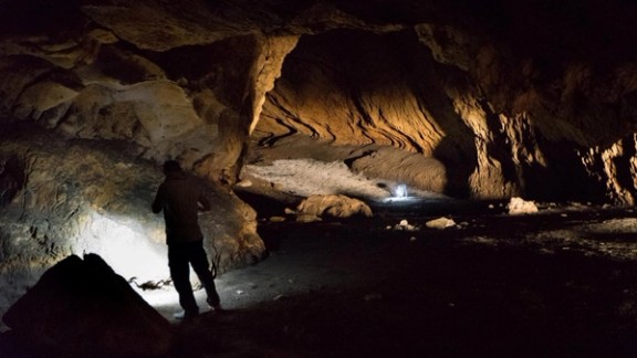 A person stands in Pebdeh Cave, in the southern Zagros Mountains, Iran, in this undated photo obtained by Reuters on March 25, 2024. Pebdeh Cave was occupied by hunter-gatherers as early as 42,000 years ago, inferred to be Homo Sapiens.