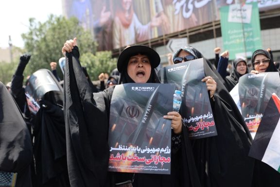People attend an anti-Israeli protest following the Israeli strikes on Iran, in Tehran, Iran, June 13, 2025.