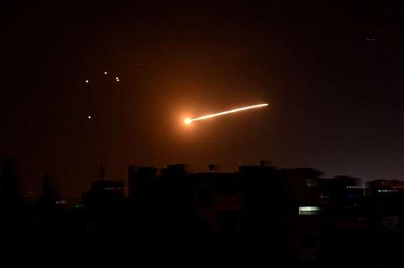 Missiles streak through the sky in an Israeli attack on Iranian targets in Syria.