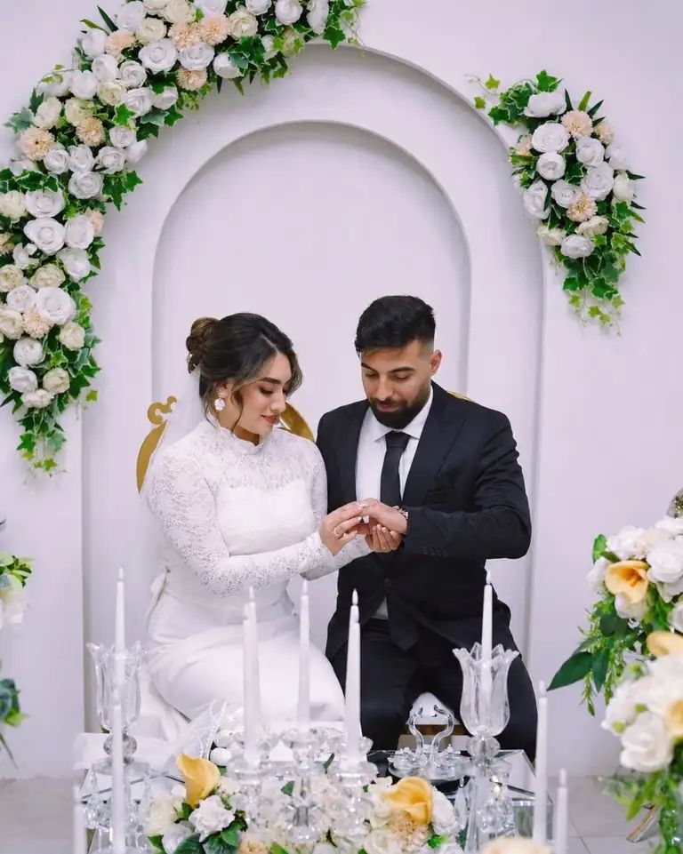 Sadegh Ghorbani and his wife, Atefeh Saei, on their wedding day. Ghorbani, 28, was shot during protests in Shahr-e Qods and died on January 10.