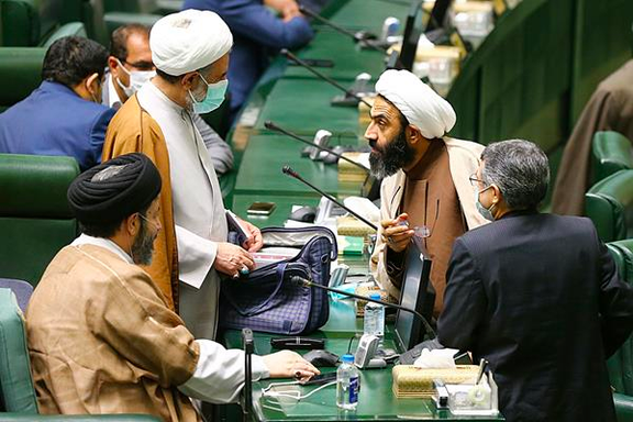 Lawmakers in Iran's parliament without masks.