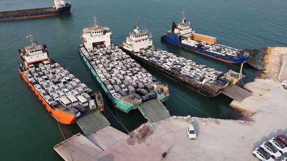 Ships unloading foreign cars in southern Iran