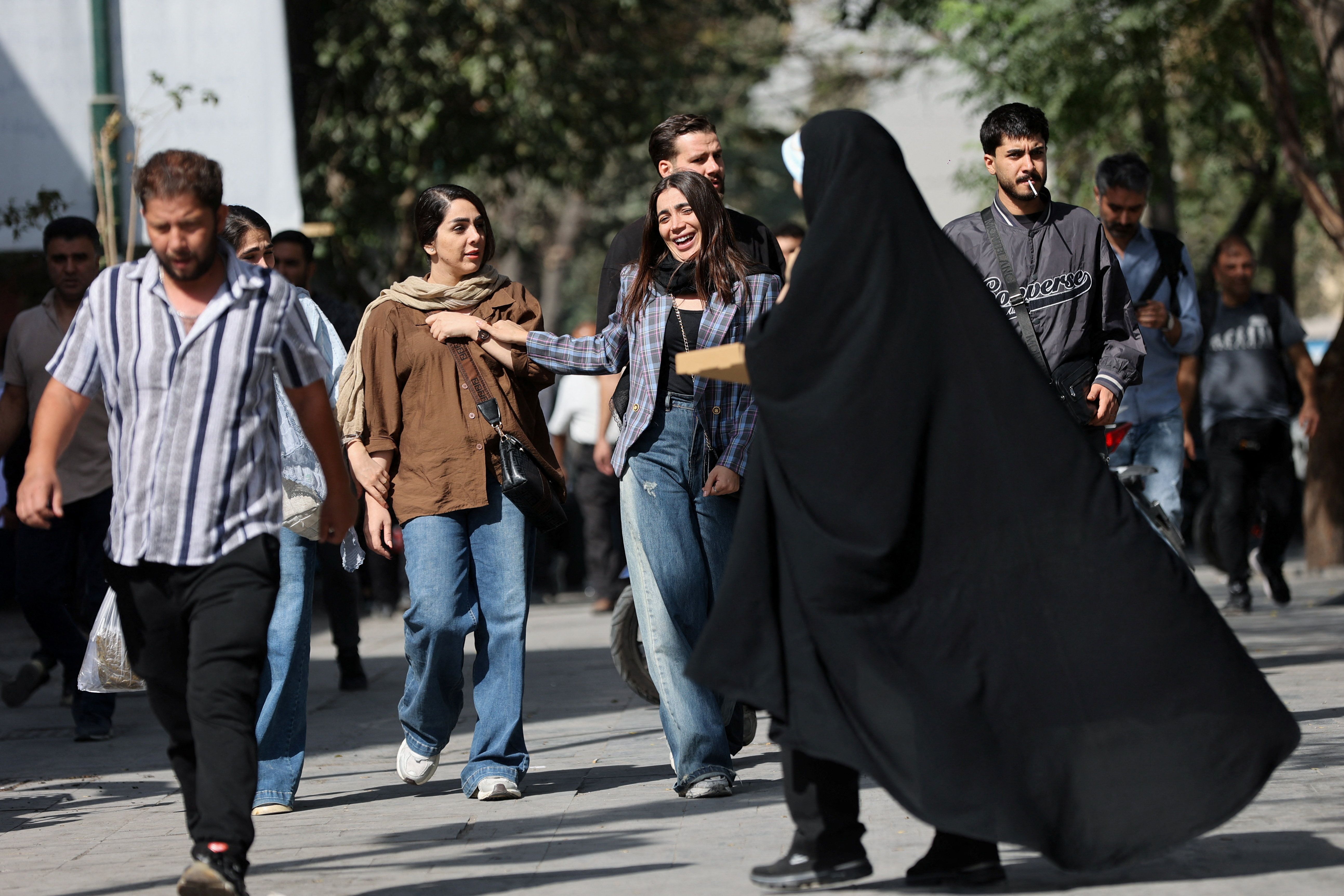 Iranian people walk at the Tehran Bazaar in Tehran, Iran, September 27, 2025. 