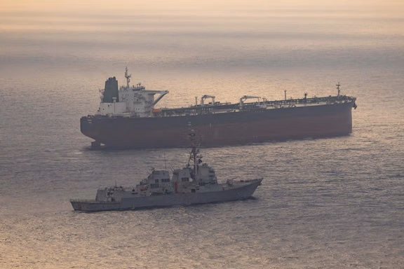 Guided-missile destroyer USS Rafael Peralta enforces the US blockade on Iranian ports against an Iranian-flagged ship, in this CENTCOM handout dated April 24, 2026