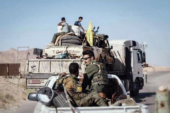Fighters from the Iraqi Nujaba militia departing Syria