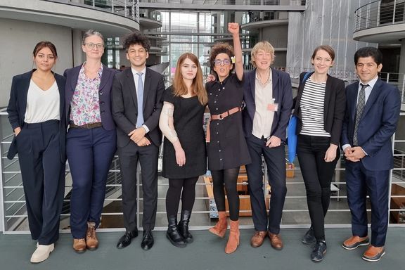 Iranian activist Masih Alinejad (5th left) in Berlin in November 2023