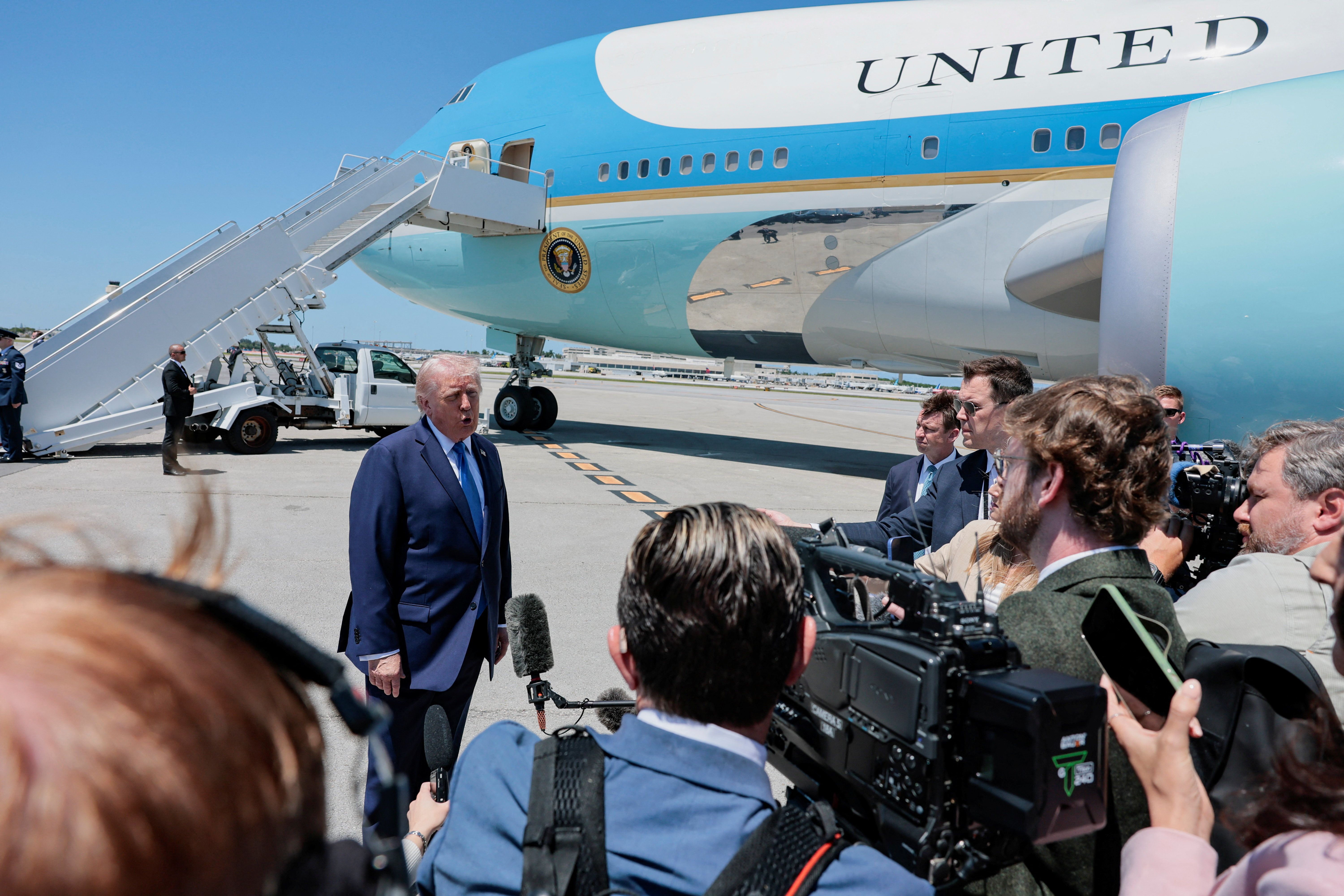 US President Donald Trump speaks to the media before departing Palm Beach International Airport en route to Joint Base Andrews, in West Palm Beach, Florida, April 25, 2026. 