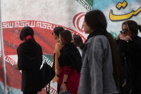 Iranian women walk on a street without mandatory hijab surveillance in Tehran, Iran, April 15, 2023.