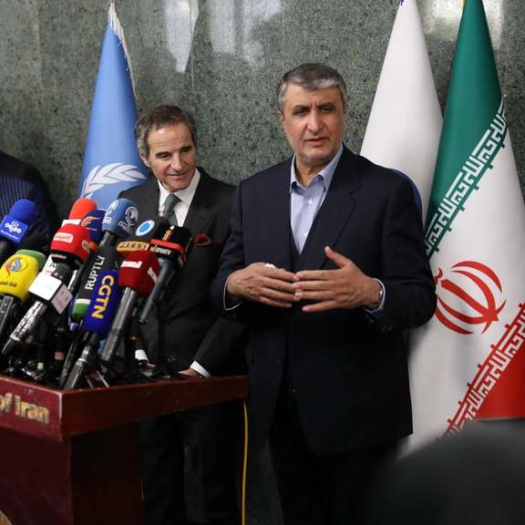 The Atomic Energy Organization of Iran (AEOI) Mohammad Eslami (right) during a press conference with International Atomic Energy Agency (IAEA) Director General Rafael Grossi in Tehran on March 5, 2022