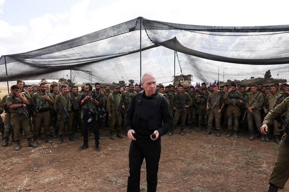 Israel's Defence Minister Yoav Gallant meets soldiers in a field near Israel's border with the Gaza Strip, in southern Israel October 19, 2023.