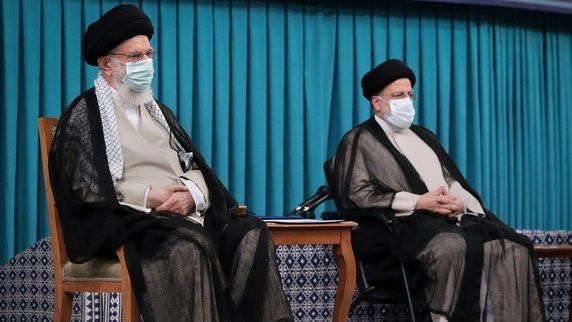 Supreme Leader Ali Khamenei and President Ebrahim Raisi after his election in 2021