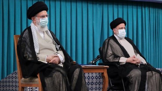 Supreme Leader Ali Khamenei (L) and President Ebrahim Raisi.