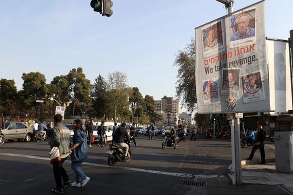 An anti-Israel banner with pictures of senior Israeli commanders that reads “We take revenge” in a street in Tehran, Iran, April 2, 2024