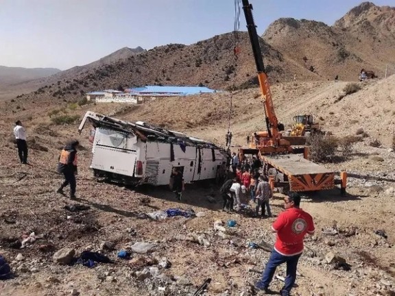 Thanks for clarifying. Here’s a corrected neutral caption: A passenger bus seen in a valley after crashing on the Damavand–Firouzkouh road northeast of Tehran, October 3, 2025.