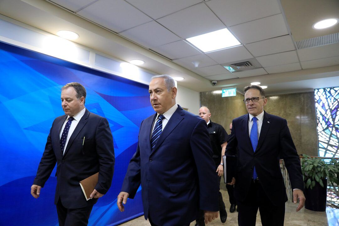 File photo of Israeli Prime Minister Benjamin Netanyahu (center) and his chief of staff, Tzachi Braverman (right) 