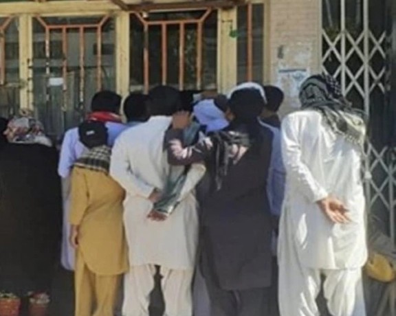 People waiting outside a bakery in Zahedan. January 2023