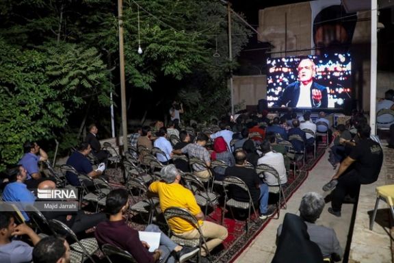 A group of Iranians watching the first presidential debate on June 17, 2024