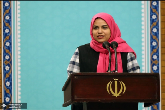 A woman speaking during a meeting of supporters with Khamenei