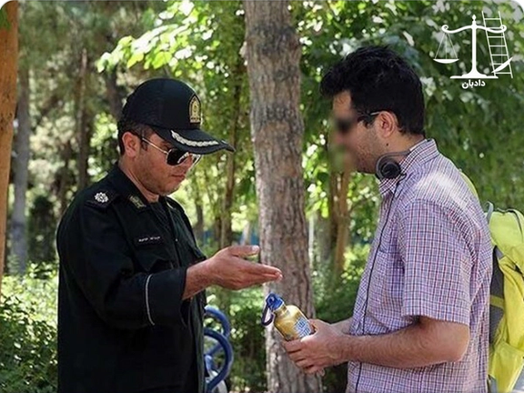 A police officer confronting a man for eating in public