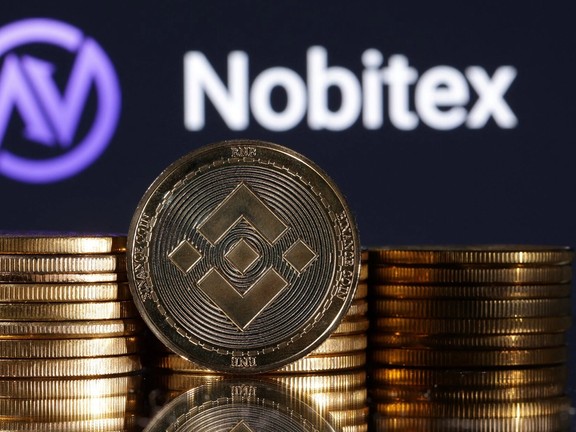 Representations of cryptocurrency Binance are seen in front of displayed Nobitex logo in this illustration taken November 3, 2022