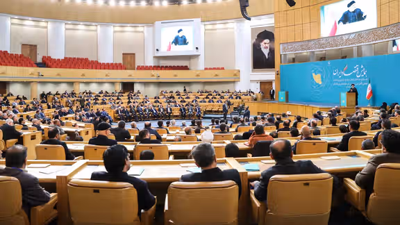Participants listening to President Ebrahim Raisi’s speech at the Iranian Economy Conference in Tehran (December 2023)