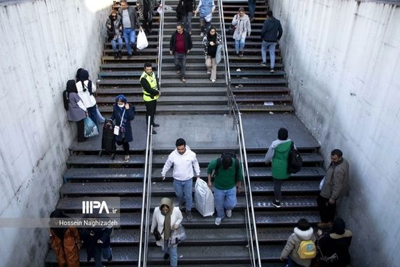 Iranians at the entrance of a subway station in Tehran on March 20, 2024
