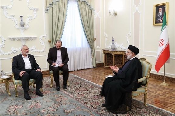 Chairman of the Hamas Political Bureau Ismail Haniyeh (left) during a meeting with Iran’s President Ebrahim Raisi in Tehran