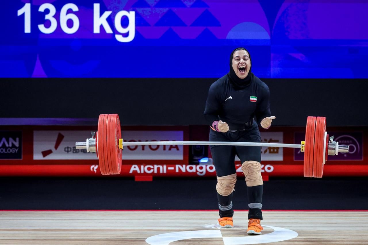 Reyhaneh Karimi celebrates after a successful attempt in the women’s 77kg weightlifting event, where she won bronze.