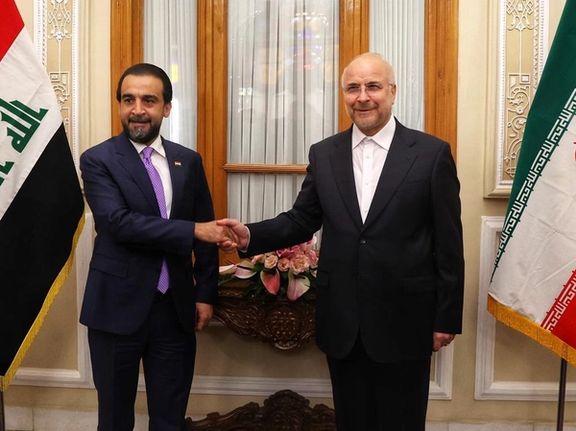 Iraq's parliamentary speaker Mohammed al-Halbousi (L) with his Iranian counterpart. April 27, 2022