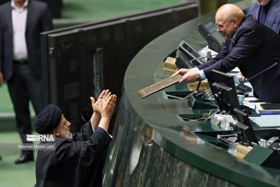 Iranian President Ebrahim Raisi (left) and Parliament Speaker Mohammad-Bagher Ghalibaf during a session of the parliament to submit the budget bill on December 5, 2023