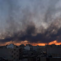 Tehran quake stirs dark humor, hopes for renewed strikes