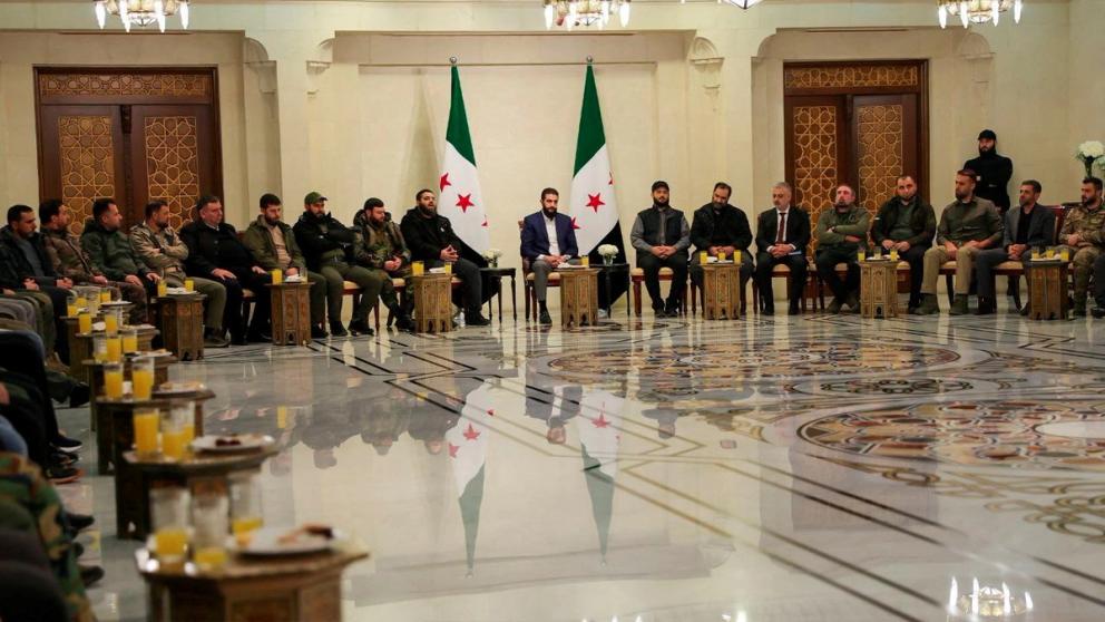 Syria's de facto leader Ahmed al-Sharaa attends a meeting with former rebel faction chiefs, as he reached an agreement with them to dissolve all groups and consolidate them under the Defence Ministry, according to a statement from the new administration, in Damascus, Syria, in this handout image released on December 24, 2024. 