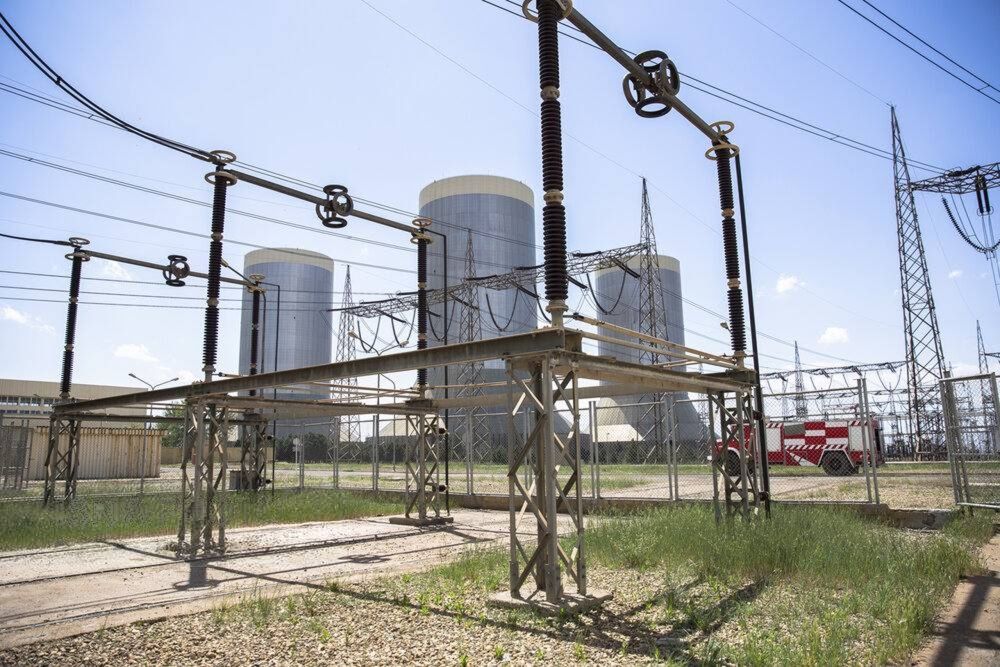 Cooling towers and electrical transmission equipment are seen at the Rajaee power plant in Qazvin, Iran, on April 25, 2025.